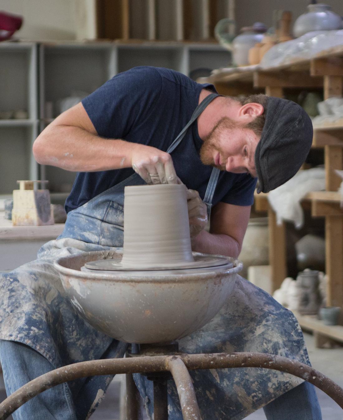 安德鲁Steingass, 艺术副教授, works with clay in the Wilson Art Center at 俄亥俄北部大学.